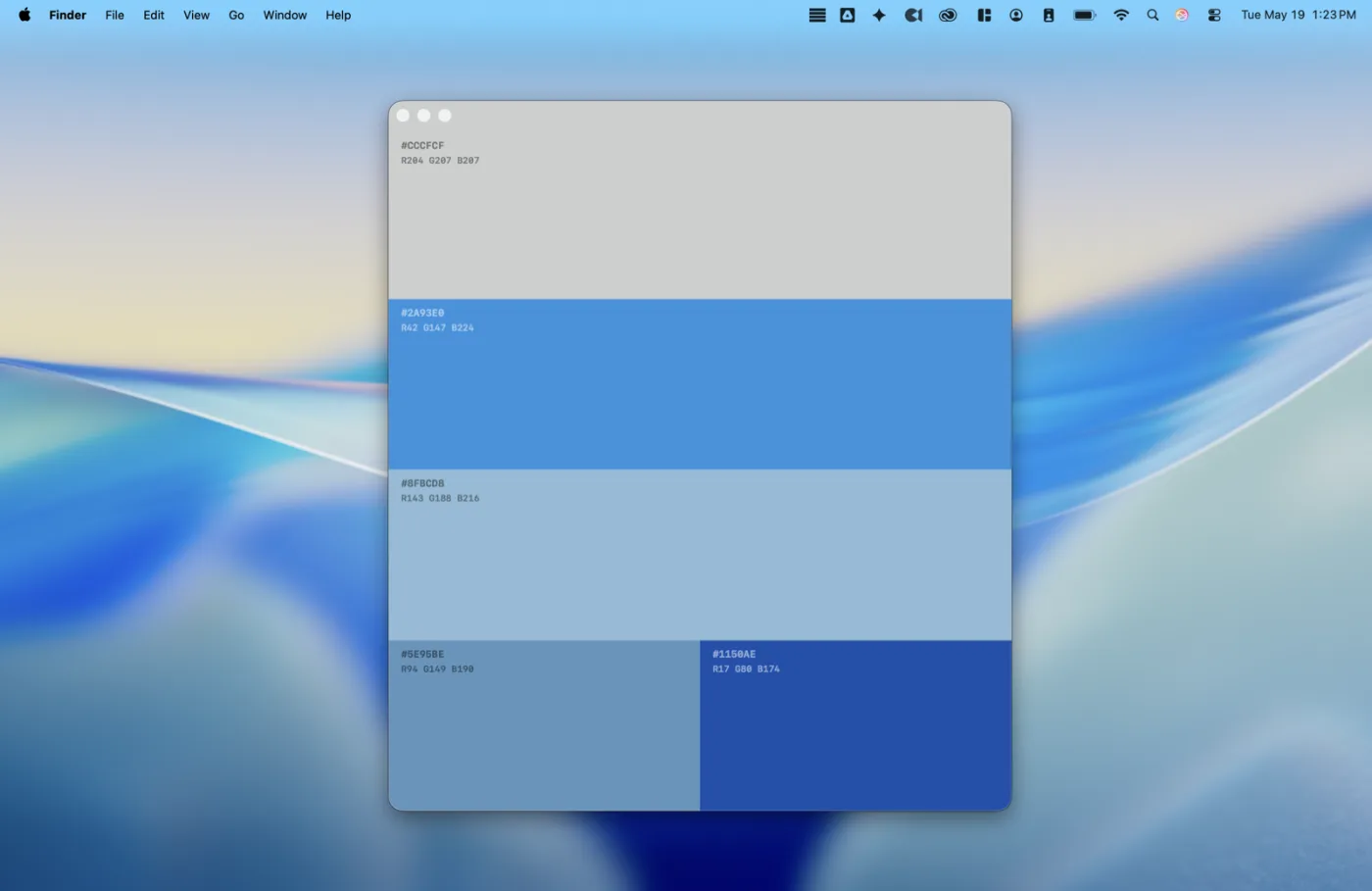 A Book of Colors running on a Mac, its palette window open on the desktop showing a blue and grey palette